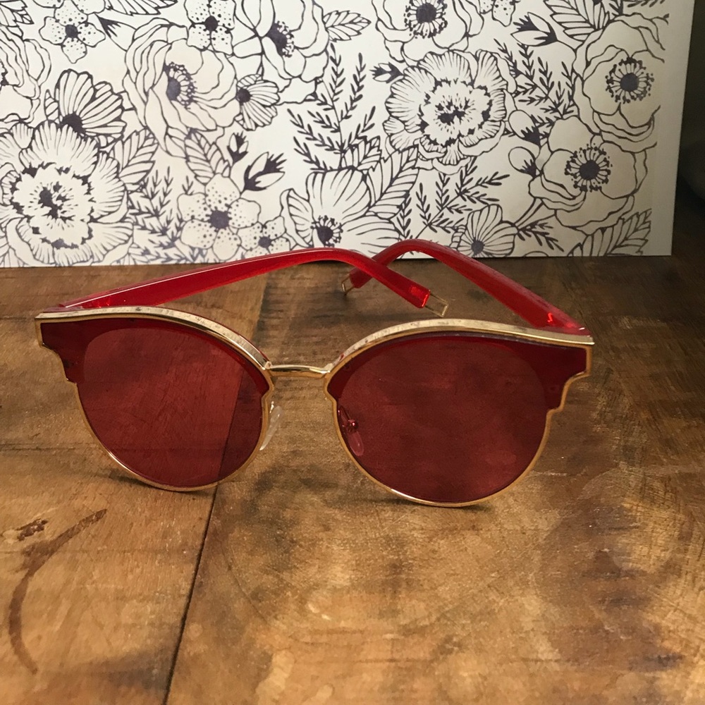 Gold framed hot pink sunglasses with case